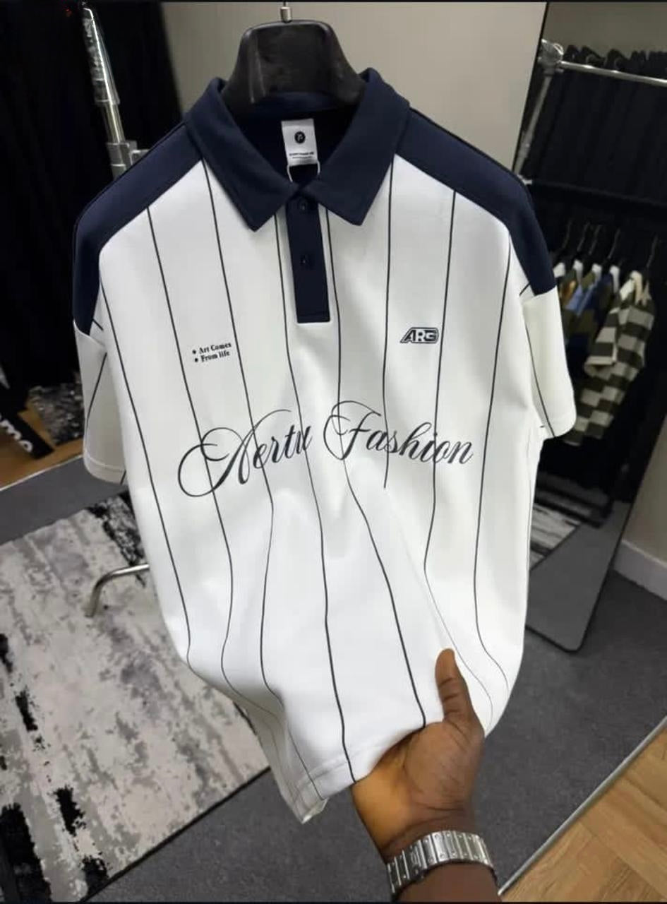 White polo shirt with black stripes and 'Aerts Fashion' branding on a hanger.